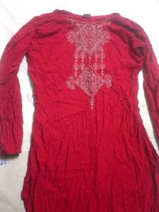 A red long size straight kurti