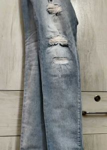 Light Blue Distressed Slim Fit Jeans.