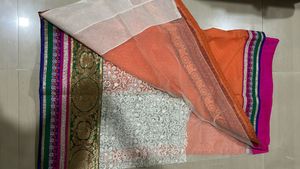 Orange Saree with Colorful Embellishments