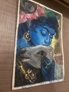 A krishna ji painting with cow
