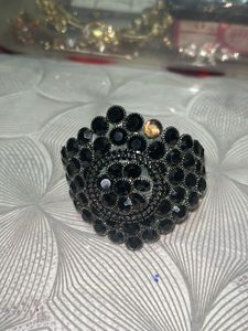 Diamond earrings with black beaded bracelet