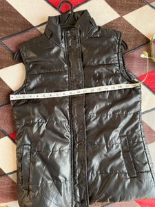 Almost brand new sleeveless black jacket