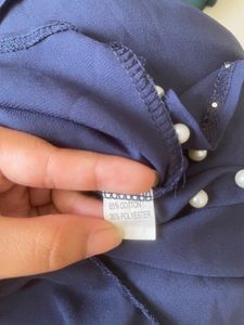 Elegant Navy Top with Pearl Details
