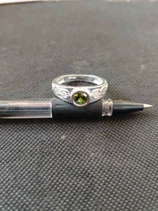 Pure silver ring with green zircon stone.