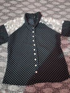 A Black Polyster Top With White Dots Nd Classic .