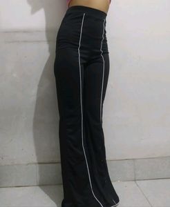 Combo of SSS black bootcut trousers and H&M peach top