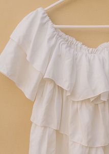 Elegant Off-Shoulder White Ruffle Top Display