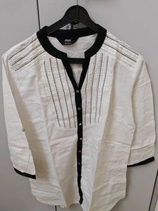 Elegant White Top with Black Trim