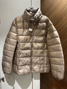 Light gold puffer jacket from Mango