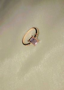 Elegant rose gold ring with a lavender stone.