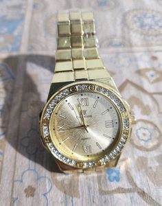 GOLD QUARTZ WITH SILVER DIAMOND WRIST WATCH
