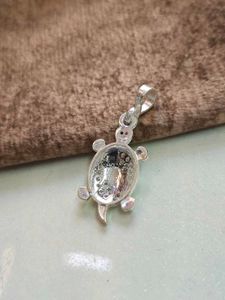 Turtle design locket with pink stone