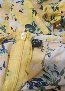 A-Line FloralPrinted Calf Length Yellow dress.