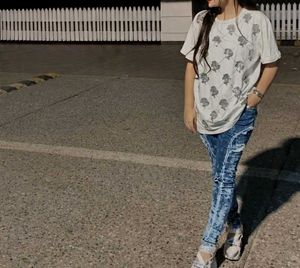 Ripped Blue Jeans With White Baggy Tshirt