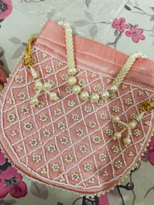 Regal Pink Pearl Potli Bag with Embellished Handle