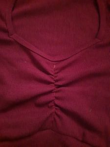 Maroon front cinch crop top with puff sleeves