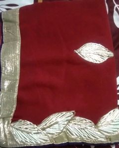 Elegant Maroon Saree with Silver Details