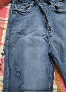 Ripped Blue Denim Jeans