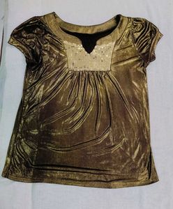 Fringed Brown  leather Skirt golden top combo.