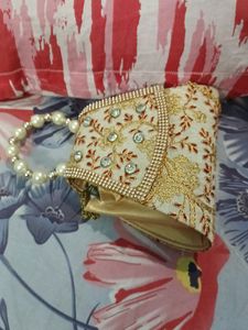 Small Clutch With Stone And Golden Embroidery Work
