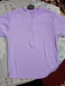 A light purple, body-fitting crop top