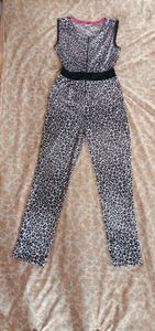Leather print jumpsuit with a  zipper on top.