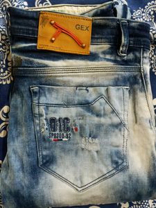 Distressed Blue Denim Jeans