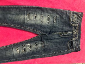 Ripped Blue Denim Jeans