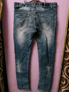 Distressed Blue Denim Jeans