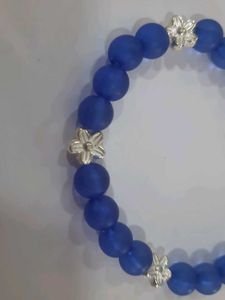 Blue Beaded Bracelet with Silver Flowers
