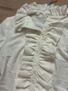 white ruffle shirt