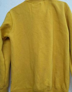 yellow pullover for men and women winter wear.
