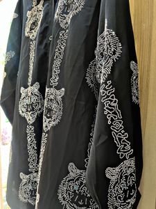 black oversized button-up shirt.