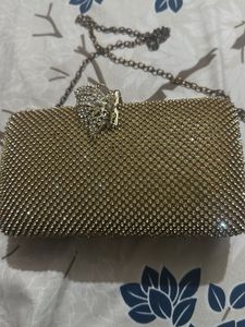 Elegant Gold Clutch with Chain