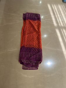 Lovely orange and purple bandhej Saree