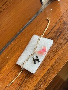 Bracelet with initial letter and real flower