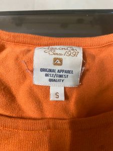 again orange broad neck top