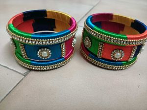 2 Sets Of Multi Colour Thread Bangles