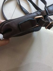 blue and dark brown sling bag
