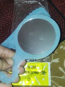 Small Mirror And Comb