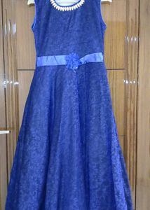 Navy Blue Gown With A Flower.