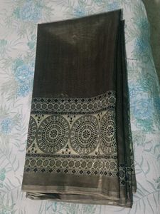 Greyish coloured saree