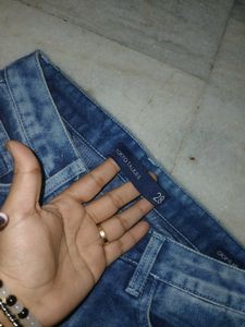 striped halter crop top and blue ripped jeans