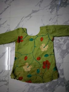 Green Embroidered short kurta top.