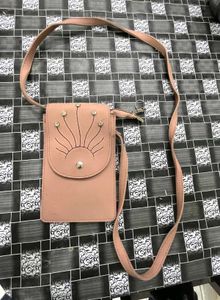 Elegant Pink Sling Bag with Embellished Sunburst