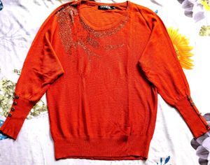 Sparkling Orange sweater.