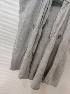 Grey Sleeveless Shrug With Button Holds