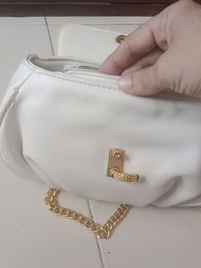 Brand New small sling with gold slin