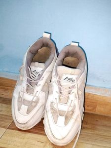 Stylish White Chunky Sneakers with Purple Sole