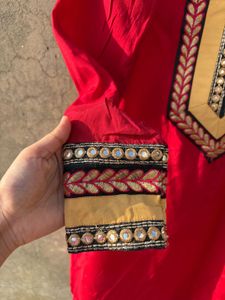 Red Embroidered Kurti With Salwar And Dupatta.